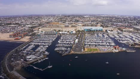 High-and-wide-panning-aerial-shot-of-the-King-Harbor-Marina-in-Redondo-Beach,-CA