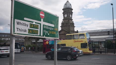 footage-of-Scarborough-town-centre,-outside-the-train-station-with-bus-and-with-Whitby,-and-Bridlington-sign-post