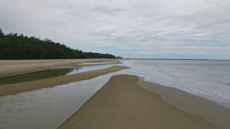 Cha-Am-Beach-in-Thailand-with-Low-Flying-Aerial-Drone-Across-the-Sand