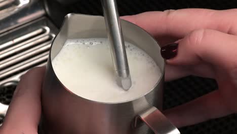 The-process-of-whipping-milk-into-milk-foam-for-cappuccino-or-latte