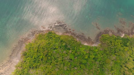 4K-aerial-drone-footage-of-Thai-coast-line,-andaman-see,-rocks-and-bushes,-Thailand,-Asia