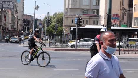 Bicycle-riders-are-cycling-across-the-streets-of-Istanbul,-Turkey