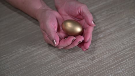 older-female-hands-catching-the-golden-retirement-nest-egg