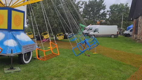 children-are-riding-on-swing-carousel,-retro-soviet-vibes