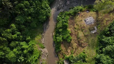 Aerial-Drone-Footage-of-the-natural-beauty-of-Sayan-jungle-featuring-verdant-trees-and-calm-waterways-in-Ubud,-Bali