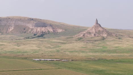 Aerial-of-Chimney-Rock-Nebraska-surrounded-by-high-prairie-landscape