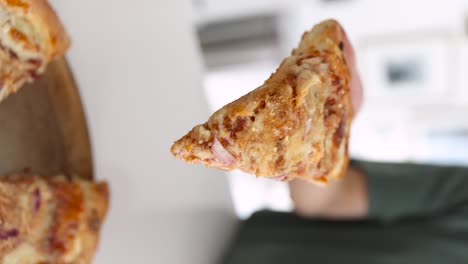 Vertical-View-Of-Hand-Taking-A-Piece-Of-Slice-Homemade-BBQ-Chicken-Pizza