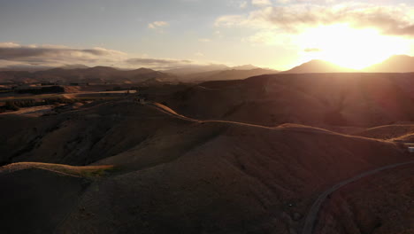 4K-Drone-shot-over-mountains-or-dunes-in-New-Zealand-during-sunset