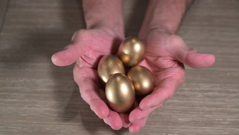 senior-citizen-hands-reveal-a-handful-of-golden-retirement-nest-egg-ideas-for-retirement-wealth