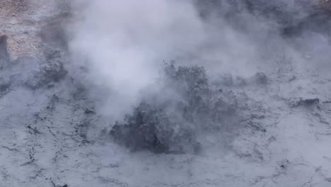 The-steam-rising-from-the-mud-volcano-is-a-visible-sign-of-the-intense-heat-and-pressure-beneath-the-Earth's-surface,-a-reminder-of-the-dynamic-forces-that-shape-our-planet