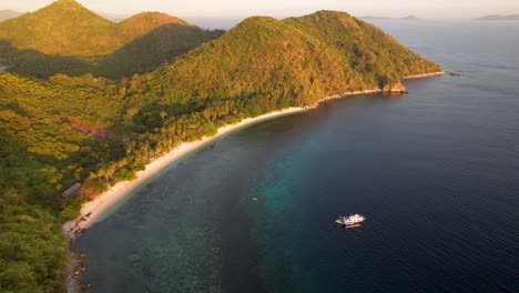 4K-drone-video-flying-backwards-to-reveal-more-of-a-beautiful-tropical-island-paradise-in-Palawan,-Philippines