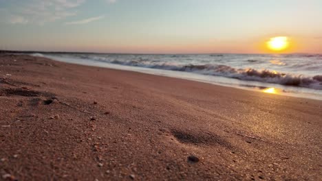 A-breathtaking-sunset-casts-warm-hues-over-the-gentle-waves-of-the-Sea-of-Azov,-highlighting-the-tranquil-shoreline-of-Crimea