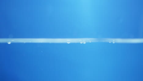 Water-waves-on-surface-with-blue-background