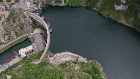 Aerial-view-of-river-stoped-by-hydroelectric-power-plant