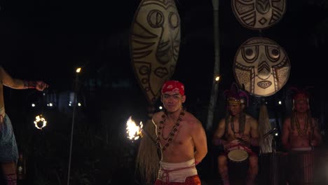 African-Rhythm-Fire-Dance-Performance-at-Bali-Safari-And-Marine-Park---Men-Fire-Jugglers-Performing-Show-With-Drums-Music-At-Night,-slow-motion