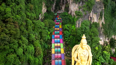 Limestone-sentry,-ancient,-grand,-In-Kuala-Lumpur’s-vibrant-land,-aerial