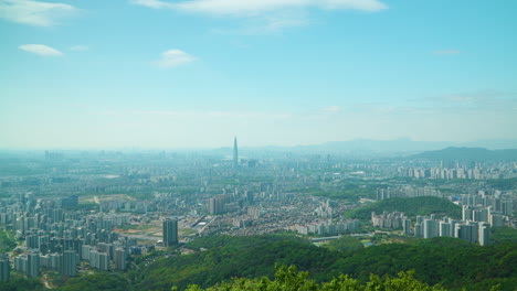 Seoul-City-Skyline-Panorama-View-from-Namhansan-Mountain-on-Spring-Sunny-Day---Panning-wide