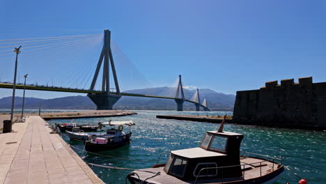 Looking-from-the-harbor-to-the-RIO-Antirrio-Bridge-in-the-Gulf-of-Corinth,-Greece