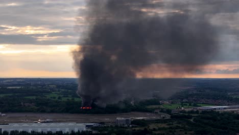 Fire-Burning-With-Black-Smokes-Over-Abandoned-Building-Near-Cheshunt,-Hertfordshire,-England,-United-Kingdom