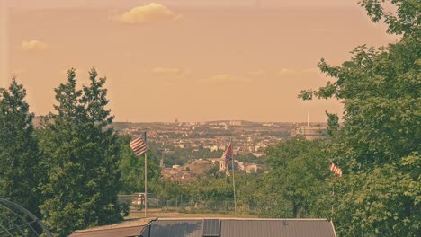 warm-sunset-mood-with-view-on-american-and-southern-states-flags-in-allotment-garden