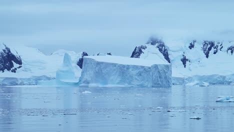 Antarctica-Iceberg-Mountains-and-Ocean,-Beautiful-Dramatic-Blue-Coastal-Landscape-and-Seascape-on-Antarctic-Peninsula-Coast,-Icy-Winter-Sea-Scene-with-Ice