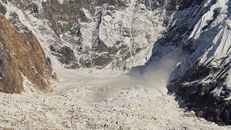 Himalayas-Mountains-Avalanche-in-Nepal,-Annapurna-Mountain-Range-Snowy-Winter-Landscape-Scenery-of-Avalanche-Falling-Down-a-Mountain-from-a-Glacier-in-Beautiful-Dramatic-Dangerous-Scene