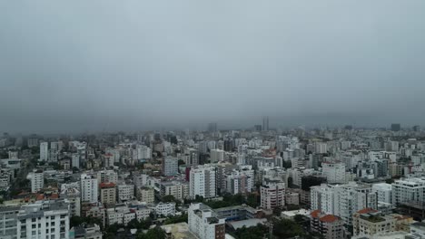 Apartment-building-in-Santo-Domingo-with-storm-clouds-from-Hurricane-Beryl-in-distance