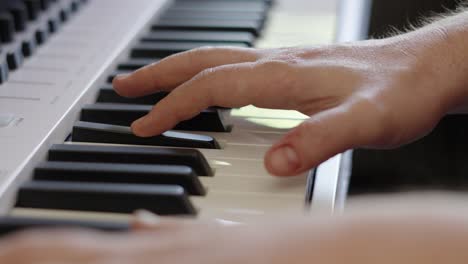 Male-Composer-Hands-Elegantly-Playing-Keyboard-Piano-Keys-in-Different-Chords-for-Recording-Session-Making-Music