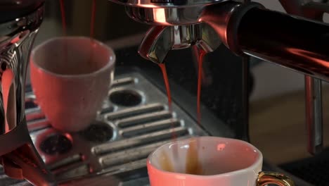 Espresso-making-process,-close-up-coffee-extraction-into-a-cup