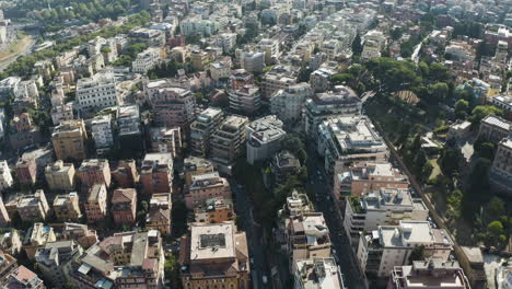 Aerial-pullback-above-urban-textured-pattern-of-Trastevere-neighborhood-Rome-Italy