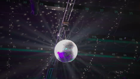 Illuminated-Disco-Ball-hanging-over-dancefloor