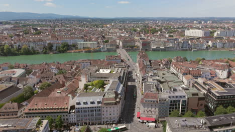 Basel's-clara-square-and-rhine-river-on-a-sunny-day,-aerial-view