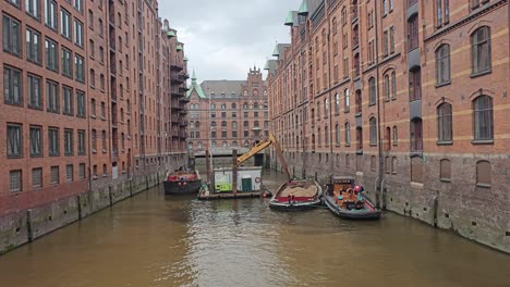 Workers-cleaning-a-canal-in-Hamburg,-Germany