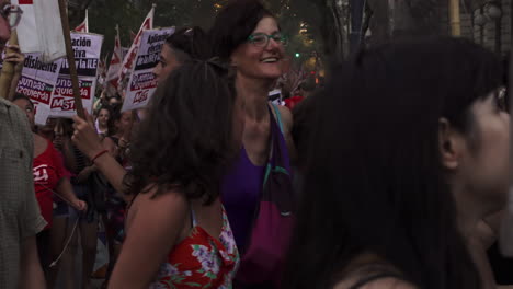 young-leftist-feminist-women-march-joyfully-with-banners-in-abortion-rally,-they-wear-purple-clothes