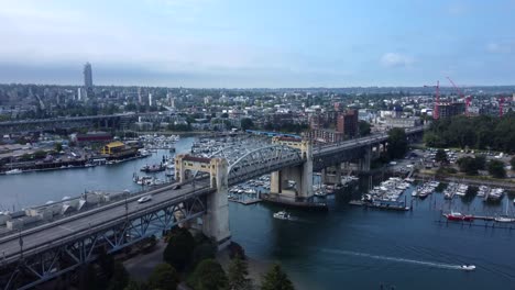 Burrard-Street-Bridge-over-False-creek-river-in-Vancouver,-Canada,-aerial