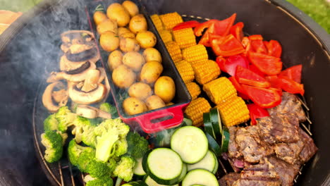 Cooking-potatoes,-peppers,-mushrooms,-corn,-broccoli,-and-squash-on-an-outdoor-grill