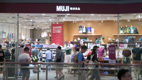 A-large-crowd-of-customers-shopped-at-the-Muji-store,-a-Japanese-multinational-household-and-clothing-retail-company