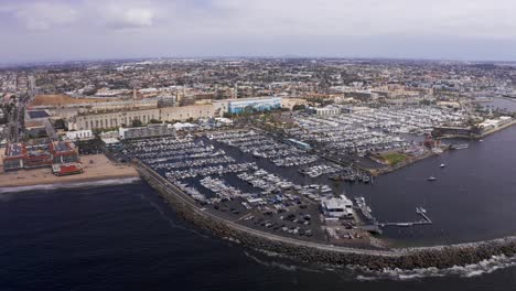 Aerial-wide-panning-shot-of-the-King-Harbor-Marina-in-Redondo-Beach,-California