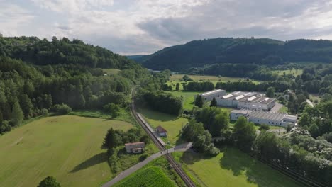 Aerial-view-of-the-production-hall-in-the-middle-of-the-natural-landscape