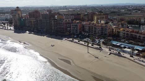 Empty-beach-Alboraya-Valencia-Spain-seaside-residential-buildings,-aerial