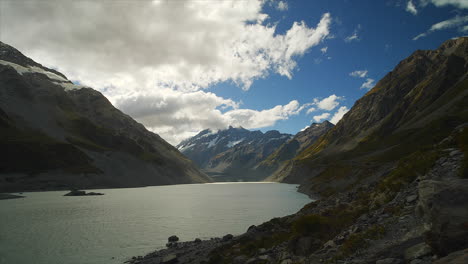 Mont-Cook,-Aoraki,-New-Zealand-in-the-distance-towers-above-Hooker-Lake-formed-from-Hooker-Glacier-melt