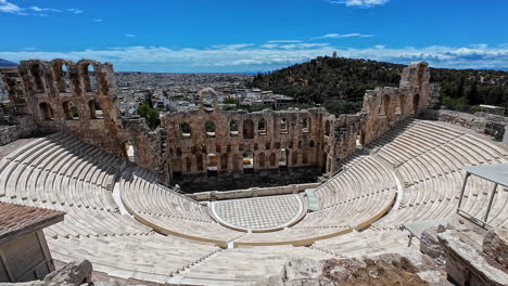 Profile-view-of-Odeon-of-Herodes-Atticus-on-a-sunny-day-at-the-Acropolis-of-Athens,-Greece