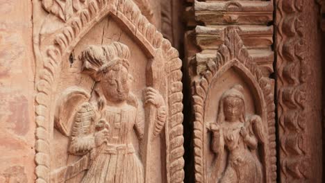 Intricate-Wood-Carving-in-Kathmandu,-Carved-Wooden-Architectural-Details-in-Amazing-Elaborate-Figures-Carved-into-Wood-in-the-Door-of-a-Temple-in-Durbar-Square-in-Nepal