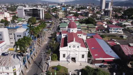 Aerial-view-of-Santa-Teresita-Church-located-in-San-Jose,-Costa-Rica,-showcasing-surrounding-buildings-and-streets