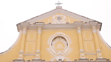 Ornate-yellow-facade-of-historic-church-with-colonial-Portuguese-architecture-in-Macau