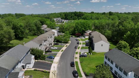 Modern-apartment-houses-with-grey-roof-in-green-idyllic-forest-suburb