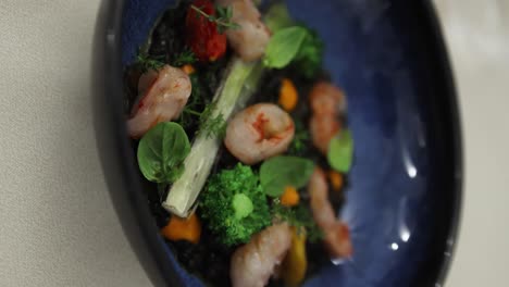 Vertical-View-Of-The-Famous-Local-Sardinian-Seafood-Dish-With-Black-Rice