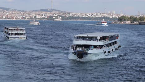 Boats-float-on-the-waters-of-Bosporus-Bay-in-Istanbul,-Turkey,-docking-along-the-coastline,-capturing-the-serene-and-scenic-essence-of-the-bay's-maritime-activity