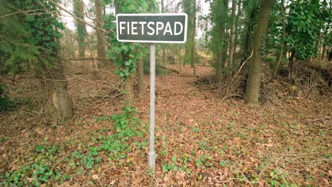 Cycle-path-traffic-sign-located-in-a-forest-in-the-Netherlands