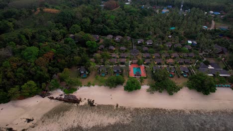 Aerial-Tropical-Beach-Resort-is-surrounded-by-green-trees